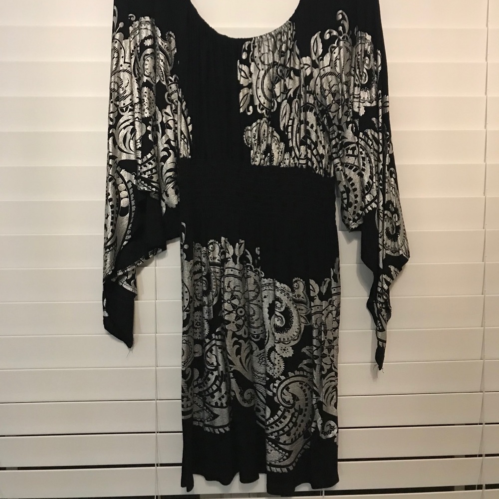 Pattern off the shoulder dress.